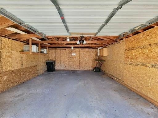 View of the garage, two wall AC units stay with the home