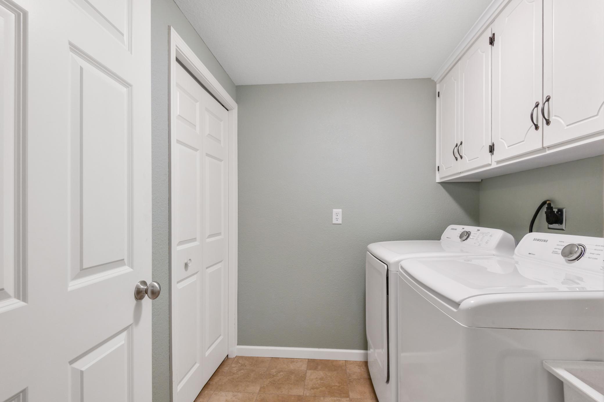 Finished laundry with big closet, laundry tub and plenty of storage