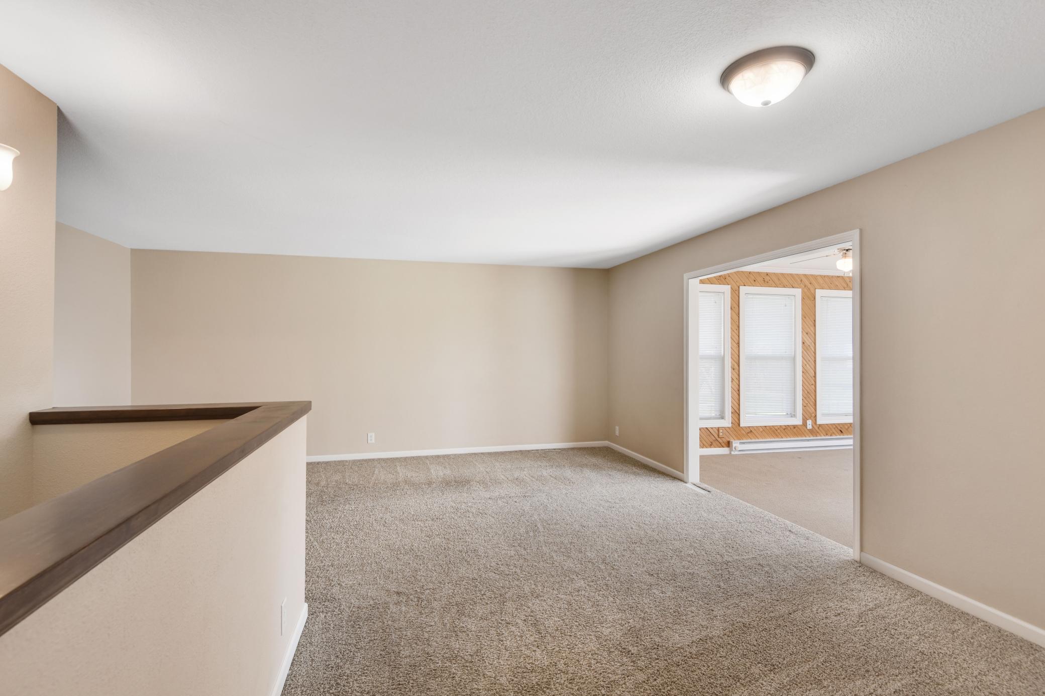 Spacious main floor living area is designed to offer multiple zones for lounging, reading, working and more