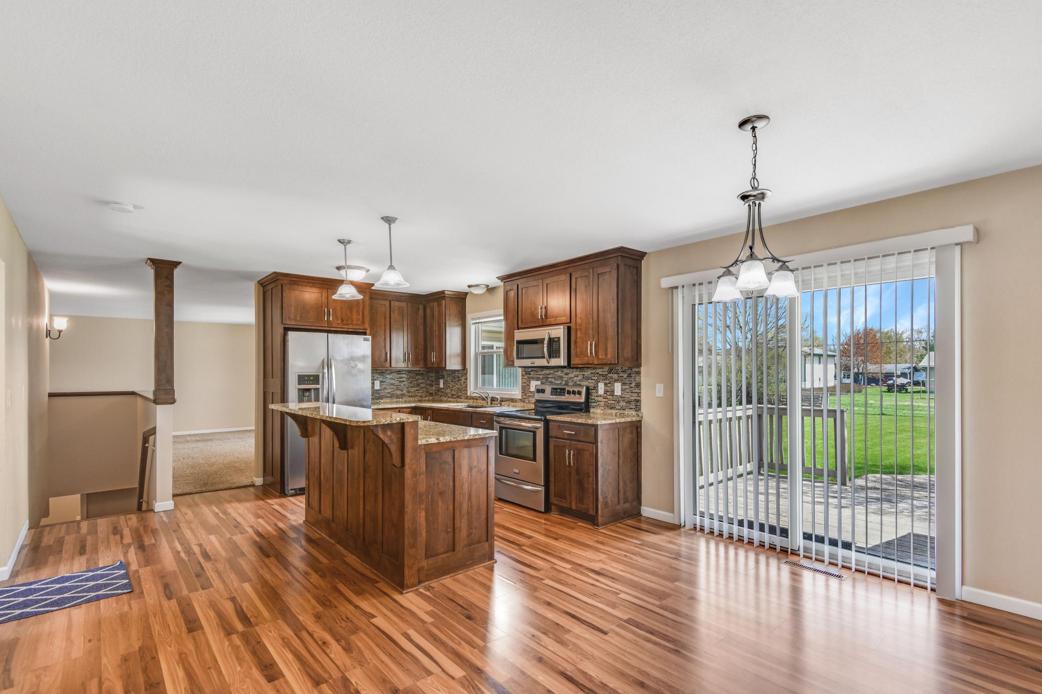 Tons of natural light and open to main floor living area & open staircase to lower level