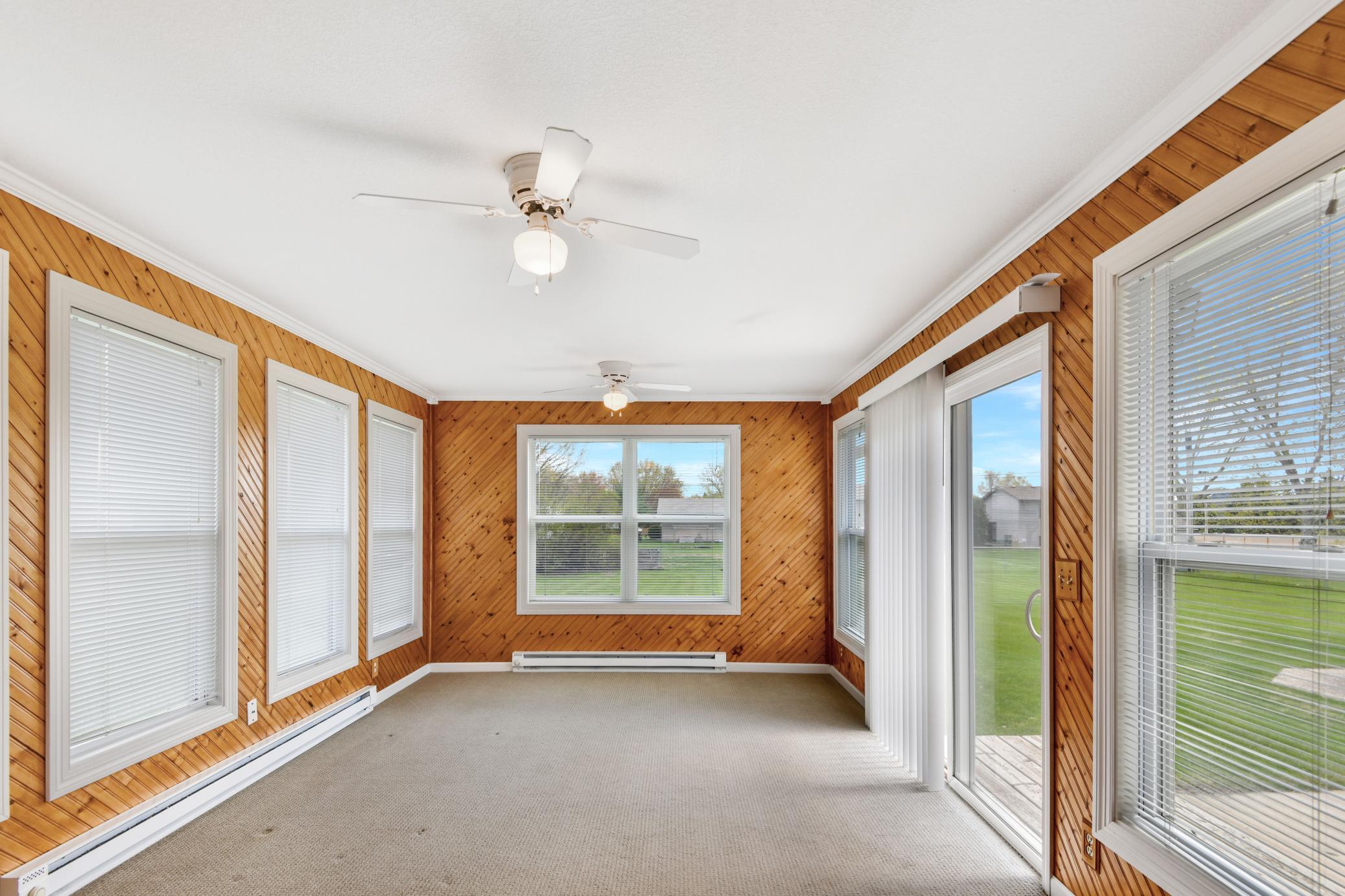 The four season sunroom adds a beautiful space for rest and relaxation ~ opens to patio for ease of outdoor enjoyment