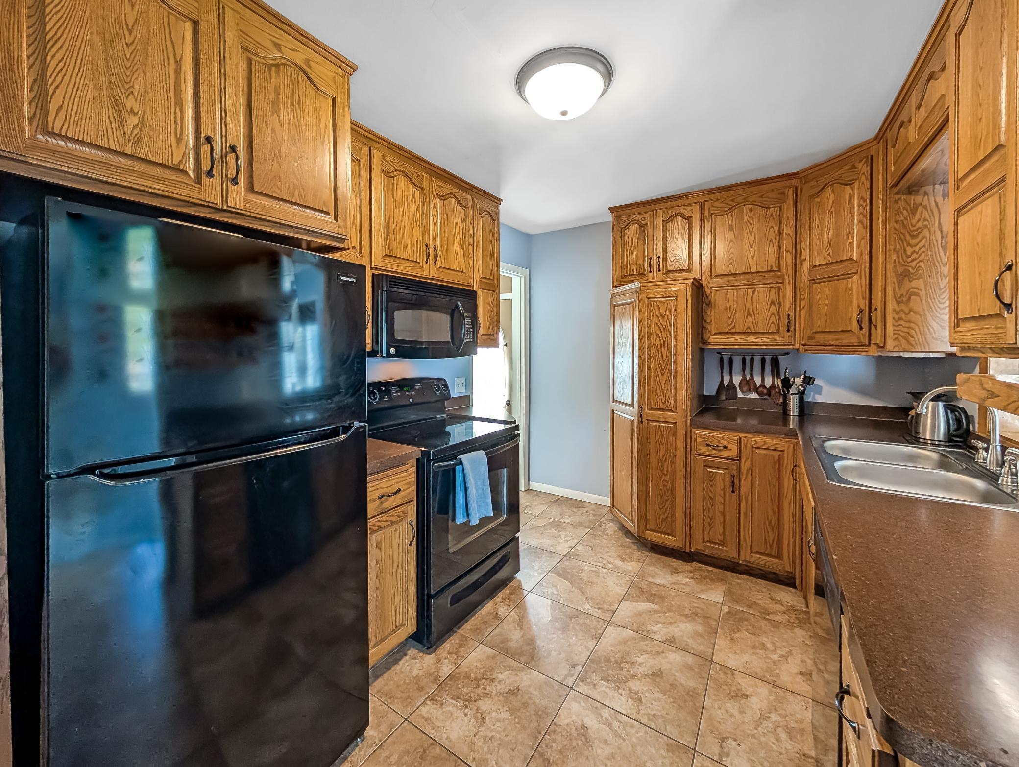 The wood in this kitchen makes it feel warm and inviting!