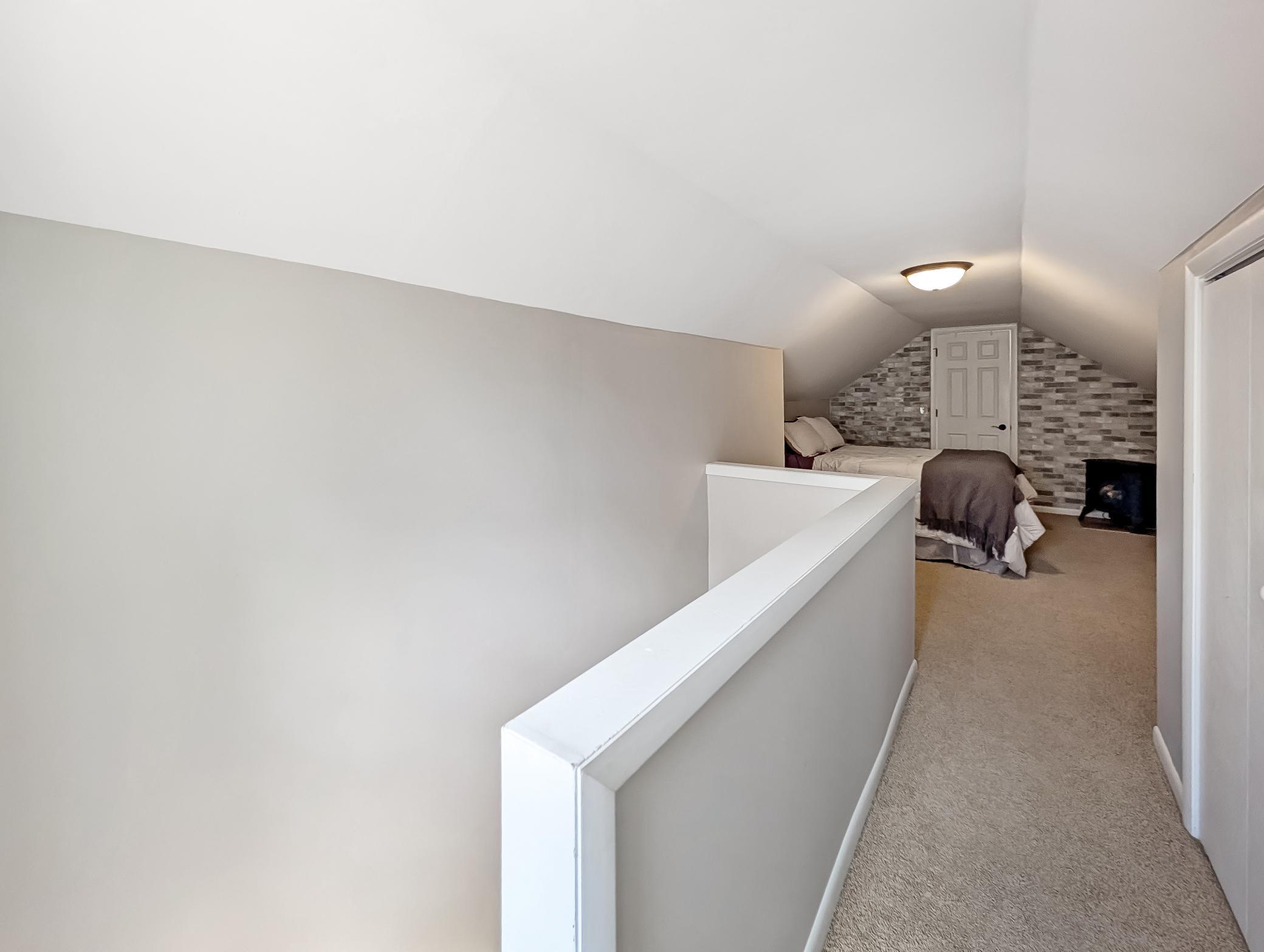 Upper half-level features closets and a unique, cozy space!