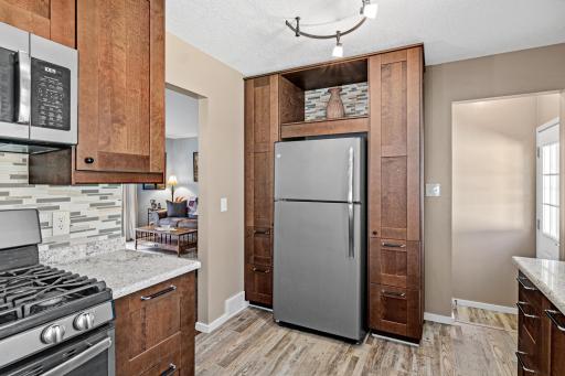 Well thought out design encorporated storage around the refridgerator.