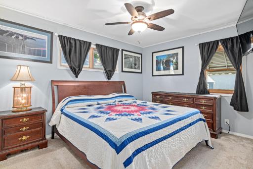 The primary bedroom can accomodate a king size bed and dressers. There are original hardwoods under the mainfloor carpets.