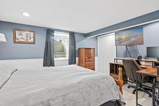 Lower level bedroom is spacious and has a walk-in closet.
