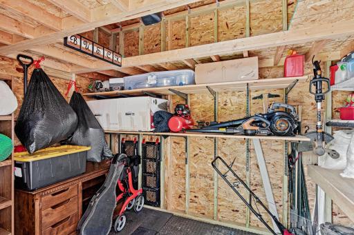 Shed has plenty of storage including a loft area.