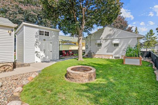 What a delightful, perfectly manicured backyard to relax and play in.