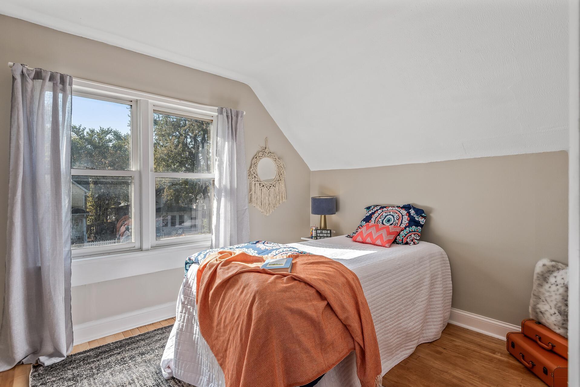 Bedroom 3 with gleaming hardwood floors
