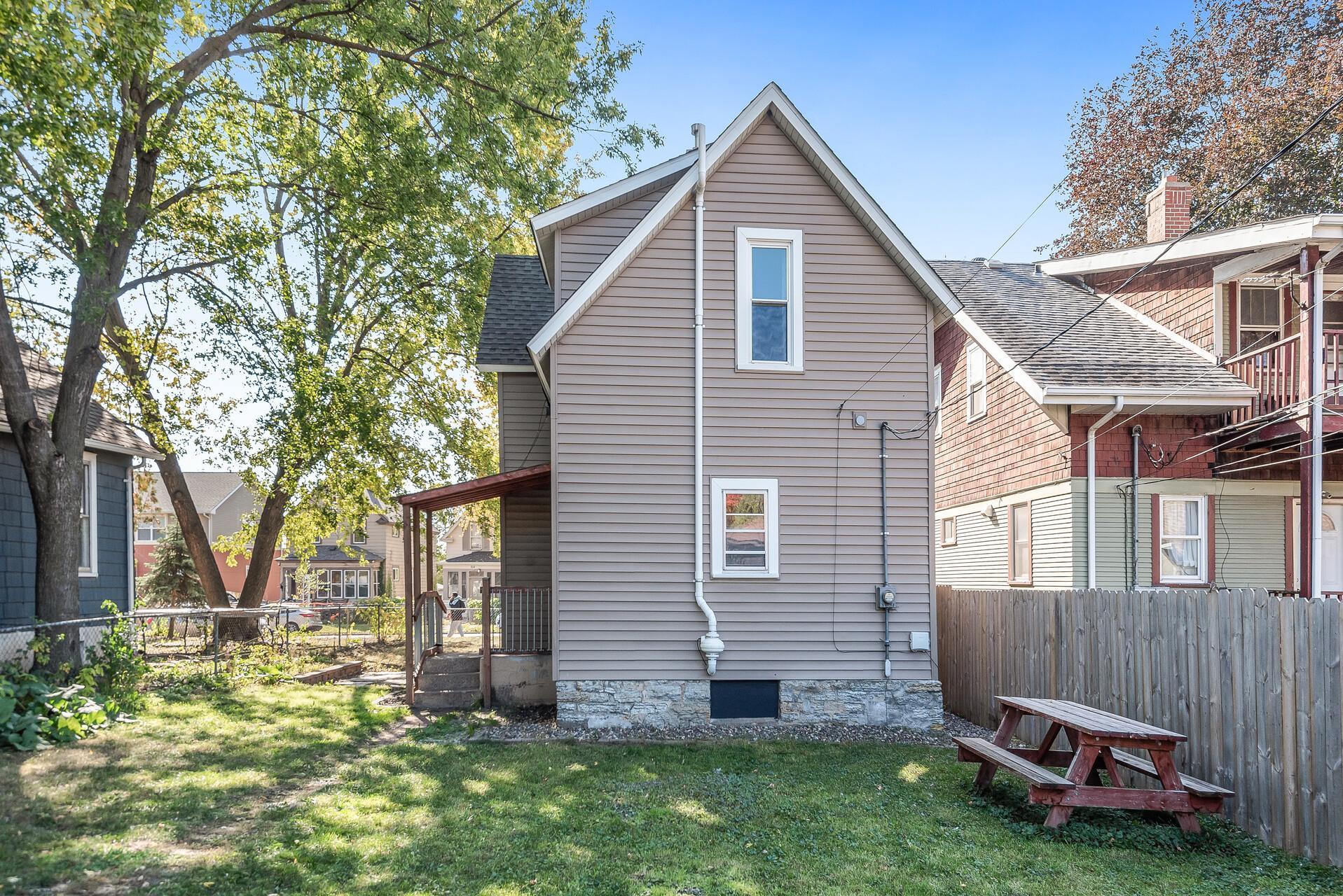 The fully-fenced backyard will keep your kids and pets corralled and also has two raised garden beds