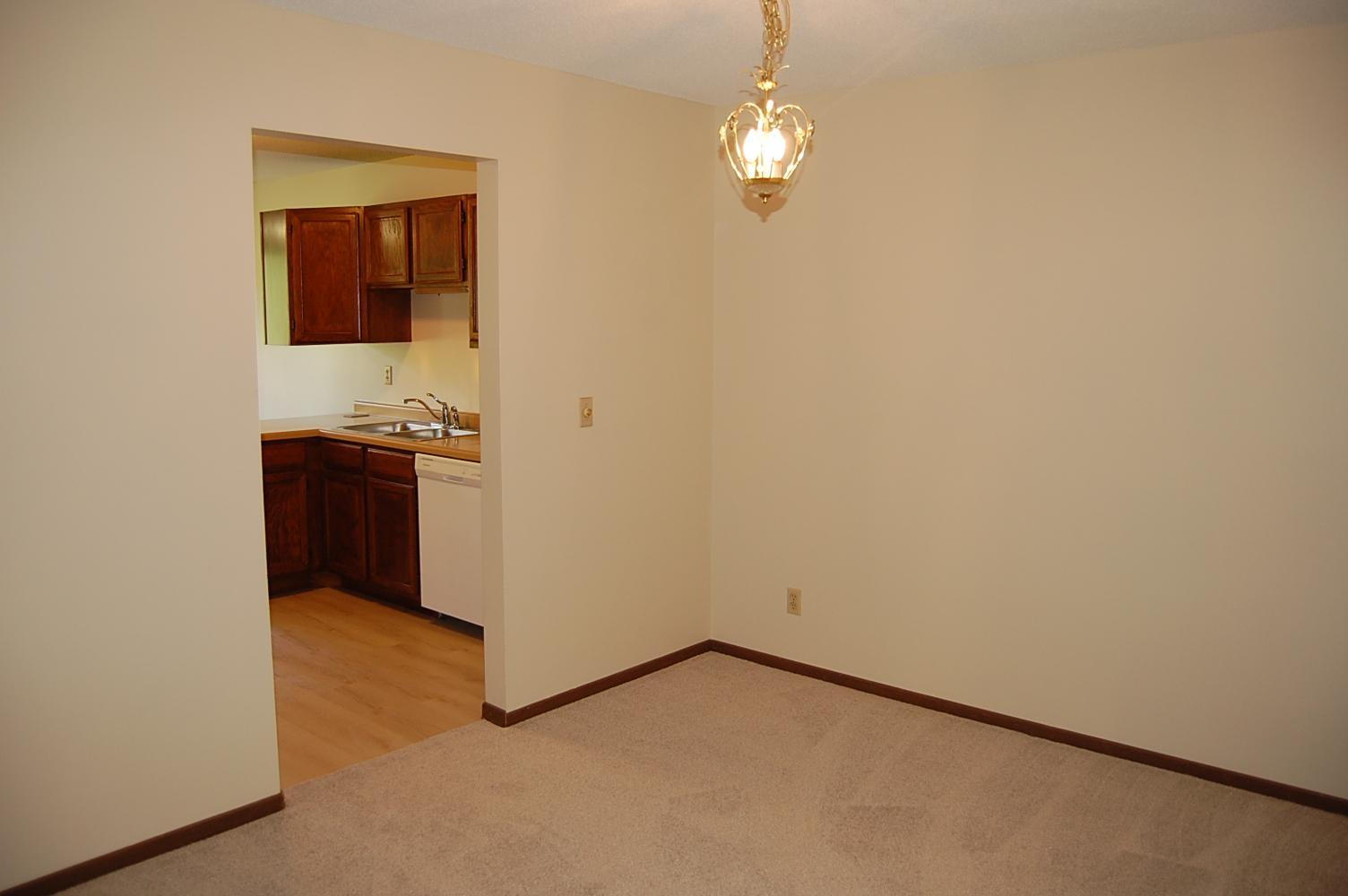 Nice sized formal dining room freshly painted with new carpet.