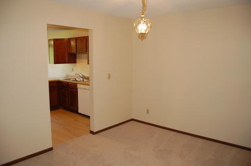 Nice sized formal dining room freshly painted with new carpet.