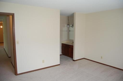 Spacious primary bedroom just painted with new carpeting. Includes a walk-in closet and a 3/4 bathroom with a new bath room floor.
