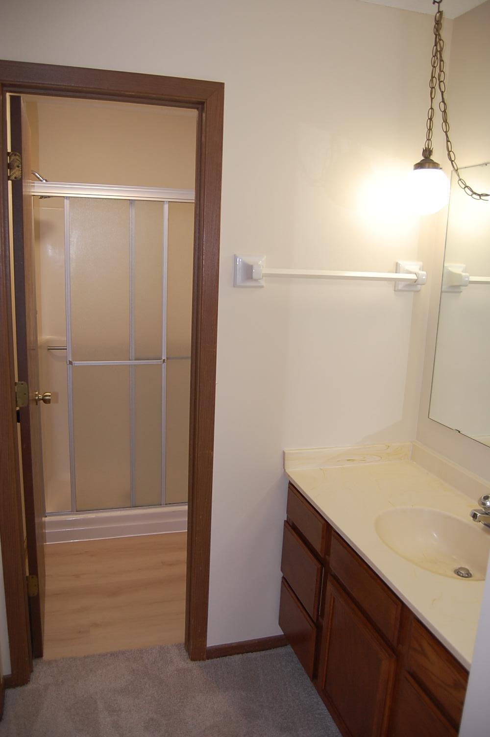 Three quarter bathroom with a new floor.