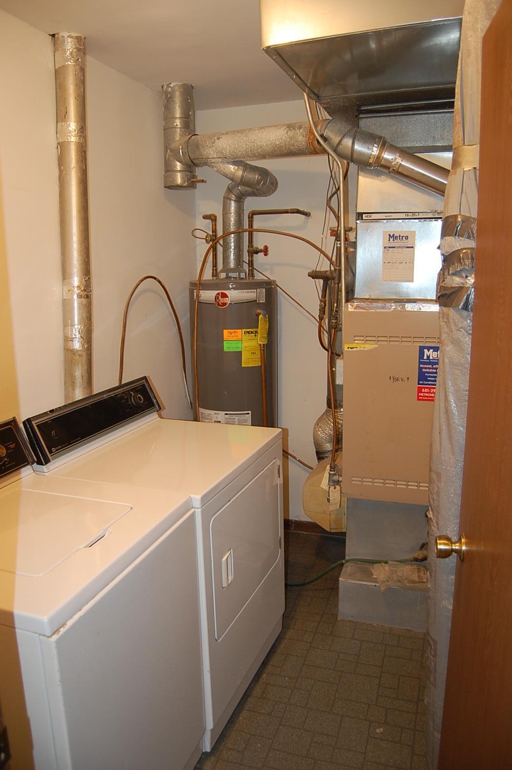 The utility room has both a washer and dryer.