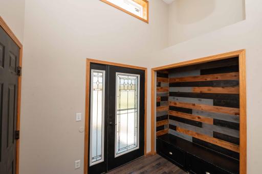 Nice large entry with handy bench for guests!