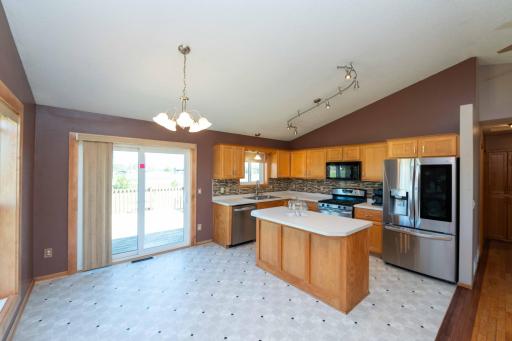 Walk out to the deck, just in time for BBQ season! Also, newer kitchen flooring.