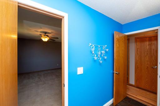 Upper bathroom walks through to primary bedroom