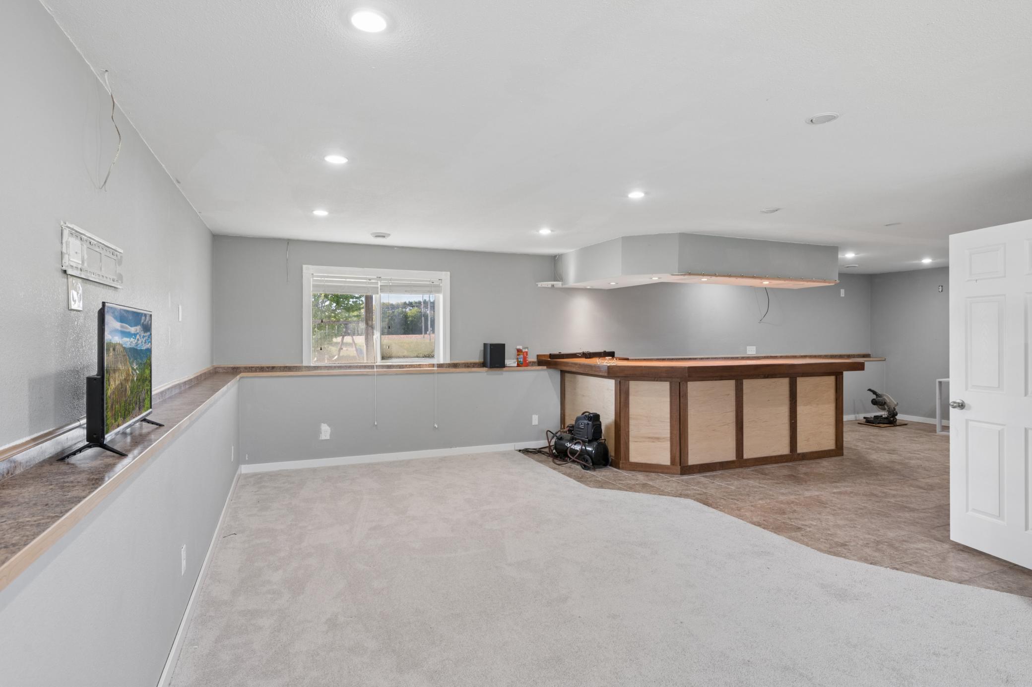 Lower level family room with large bar area