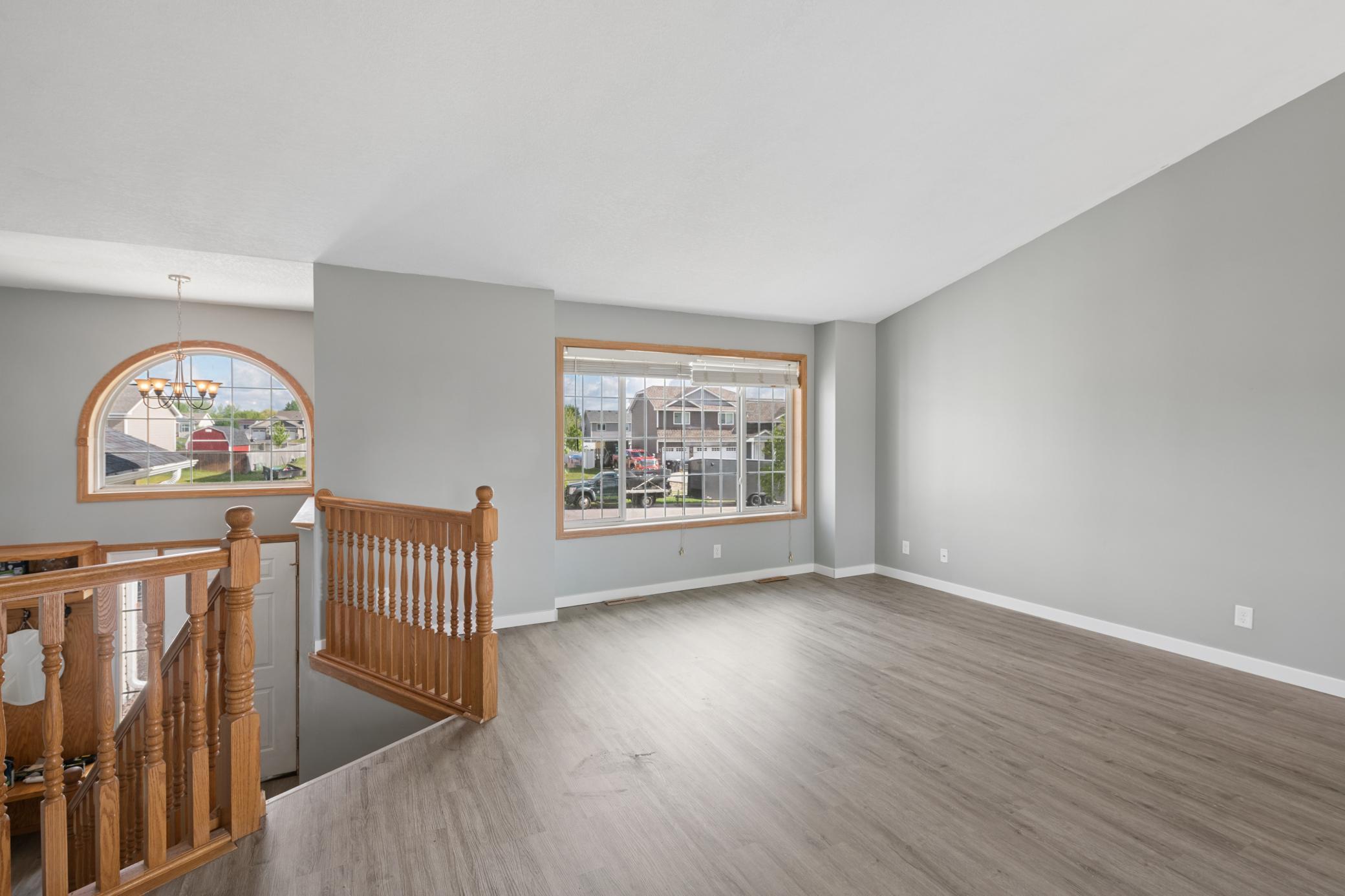 Vaulted ceiling in living room with abundance of natural light