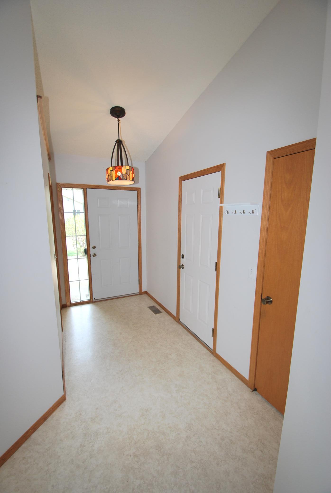 Entry with access to garage and large walk-in closet