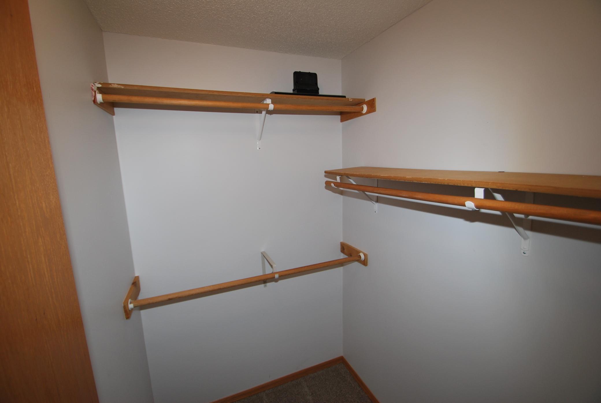 Walk-in closet space off of primary bedroom