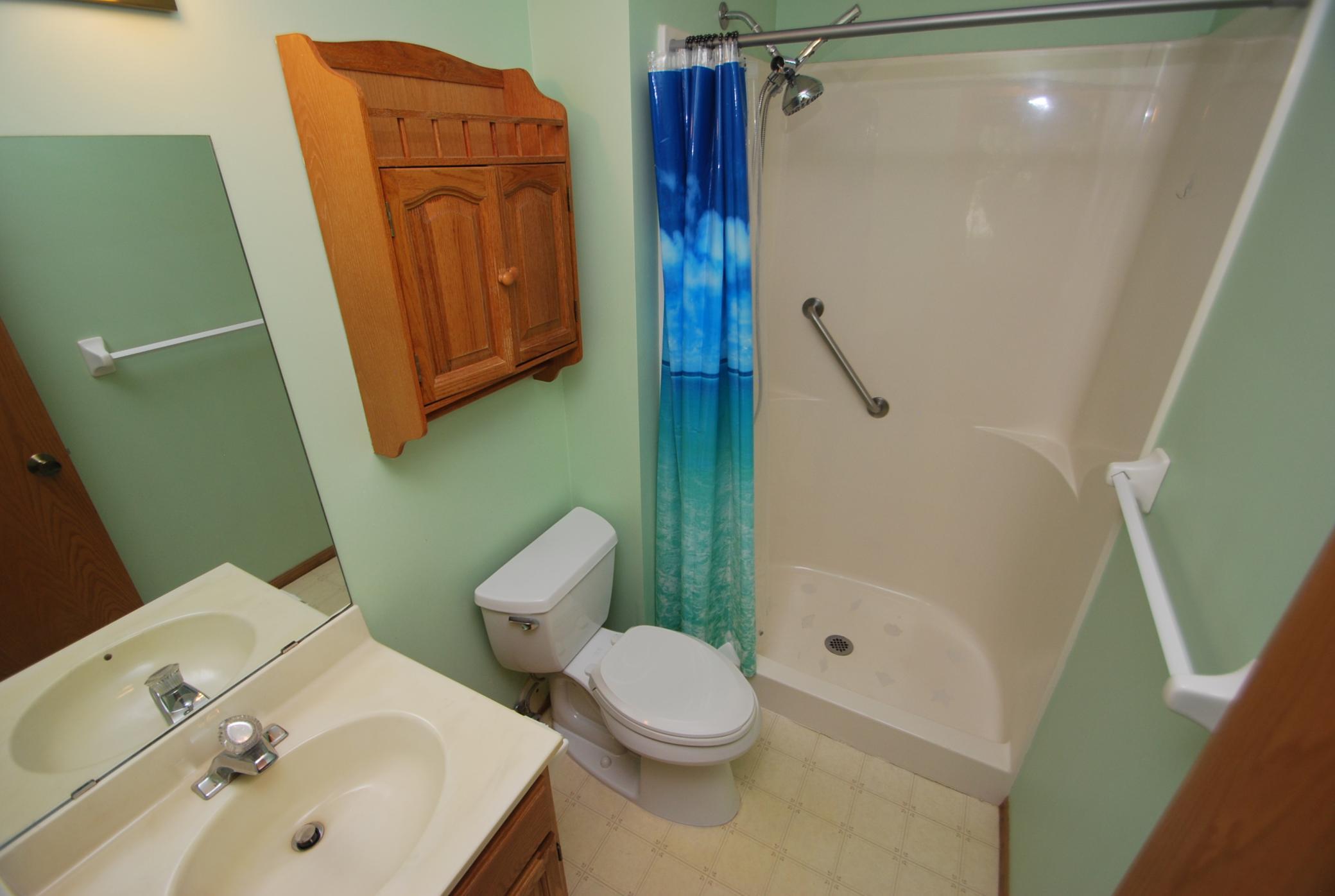 3/4 bathroom off of primary bedroom. Shower includes grab-bars.