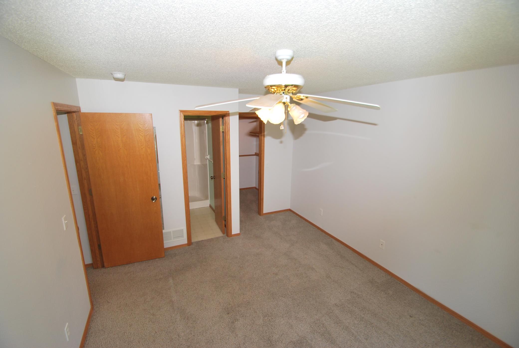 3/4 bath and walk-in closet off of primary bedroom
