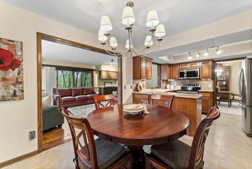 Informal dining next to kitchen and family room