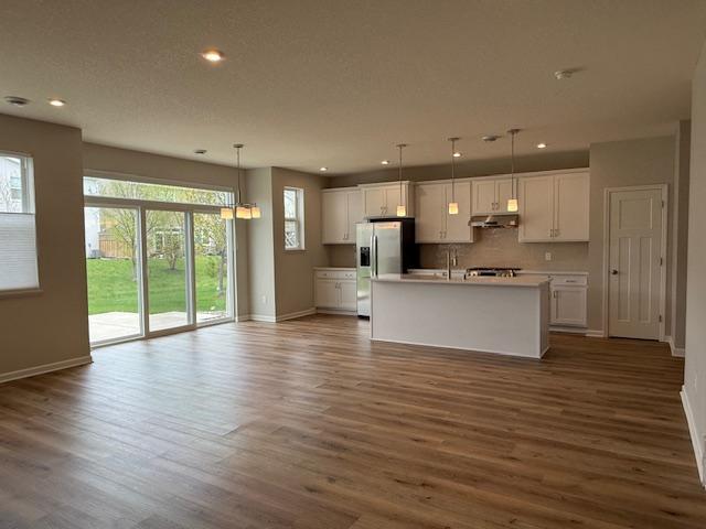 Inviting, open floorplan looking out toward the back patio.