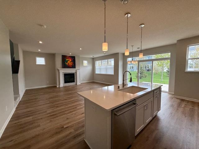 View from the luxurious kitchen area, showcasing the center island and gas fireplace!