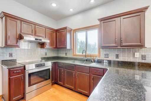 Kitchen With Stainless Steel Appliances Granite Countertop