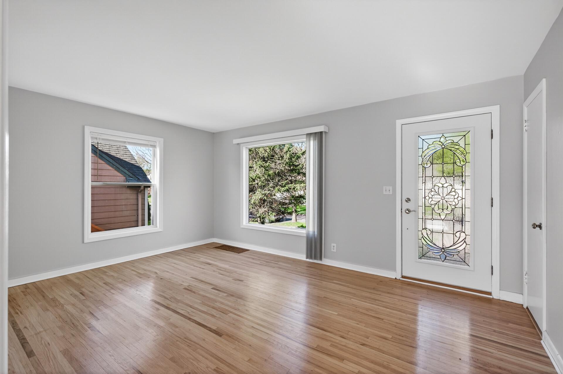 Welcoming living room with a huge picture window to enjoy the outdoors through!