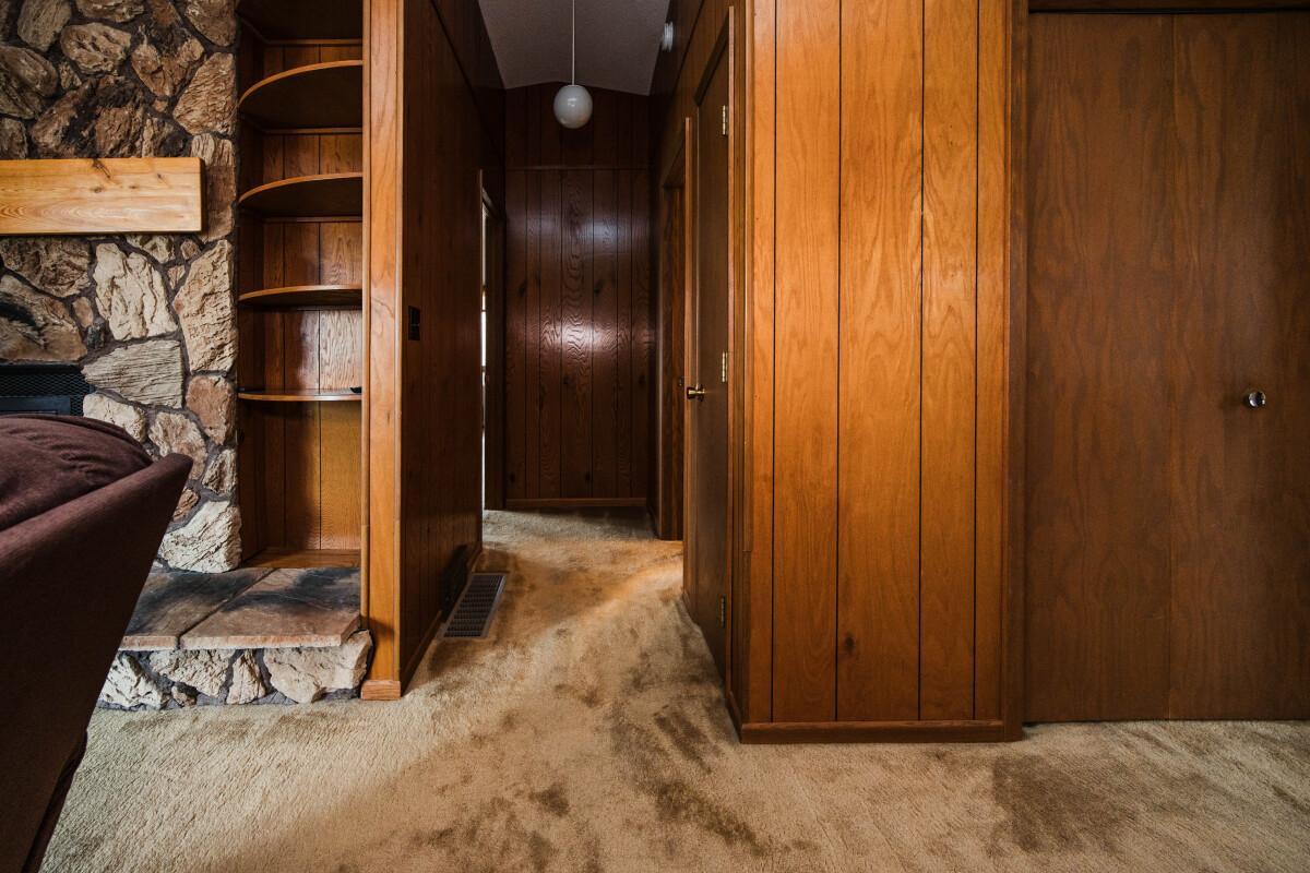 Hall to Primary Suite and Powder Room