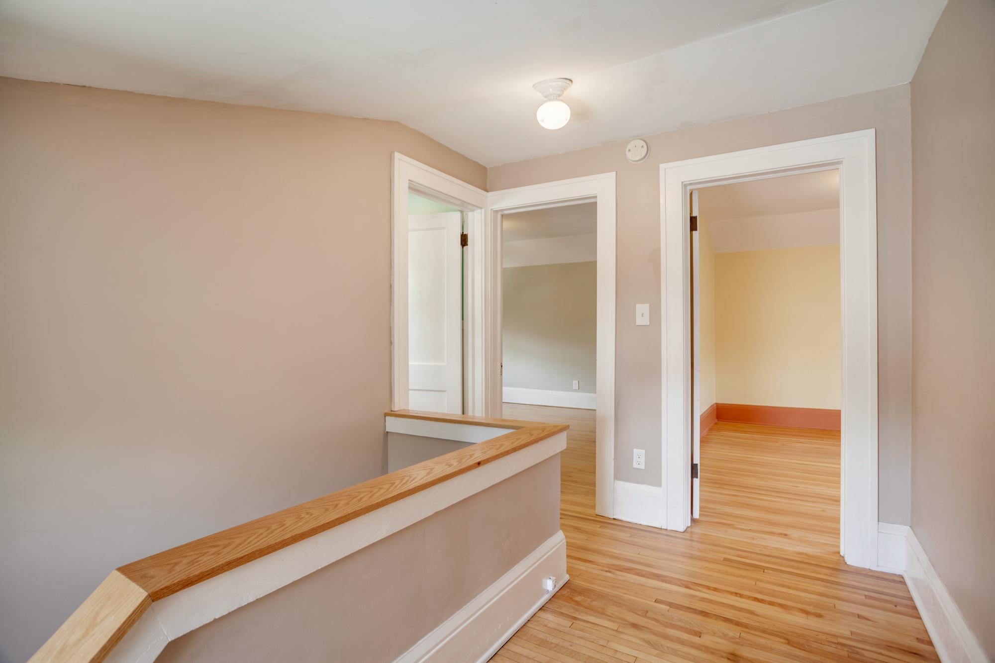 Head upstairs to find two more bedrooms and a full bathroom with clawfoot tub