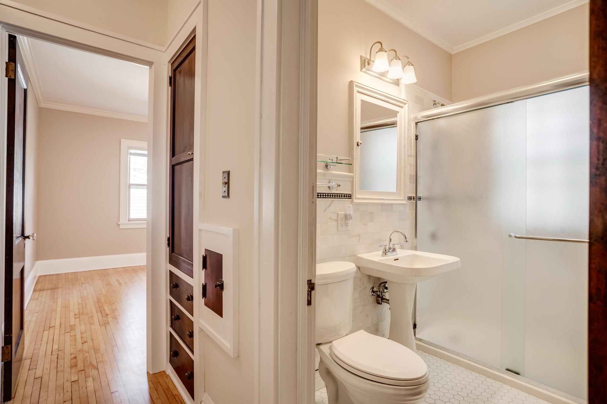 Main floor updated bathroom with step-in shower and in-floor heat