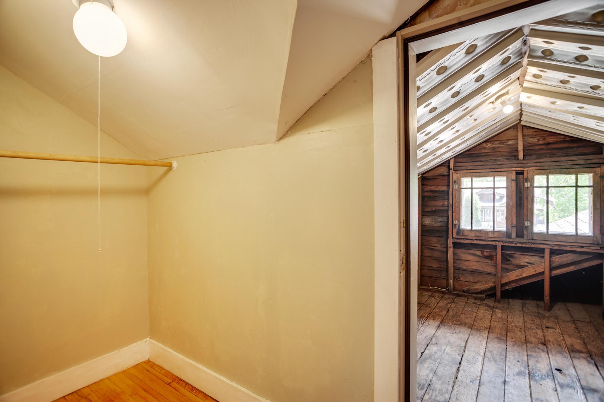 Walk through the closet to find unfinished insulated attic space - finish it off for more square footage, or use as storage space