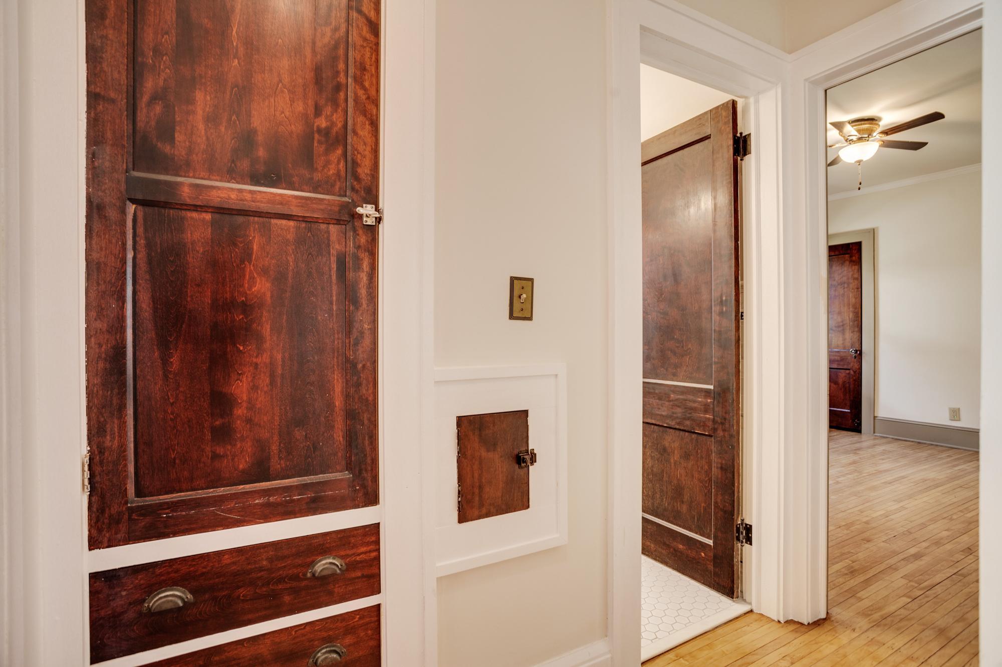 Hallway with linen closet and laundry chute