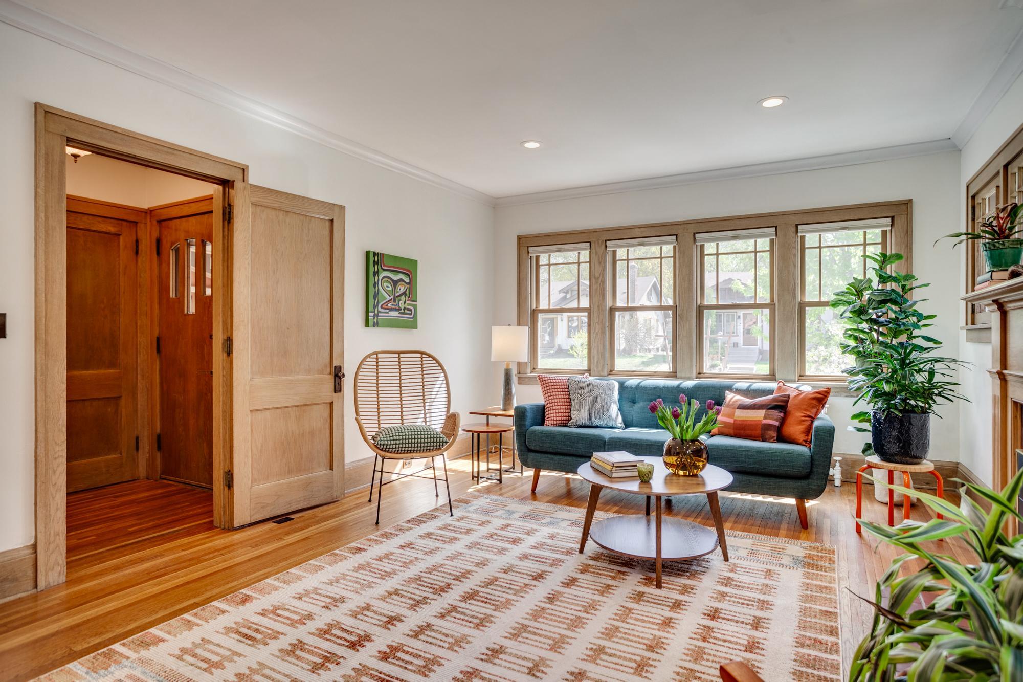 Large living room with south and east facing windows for loads of natural light