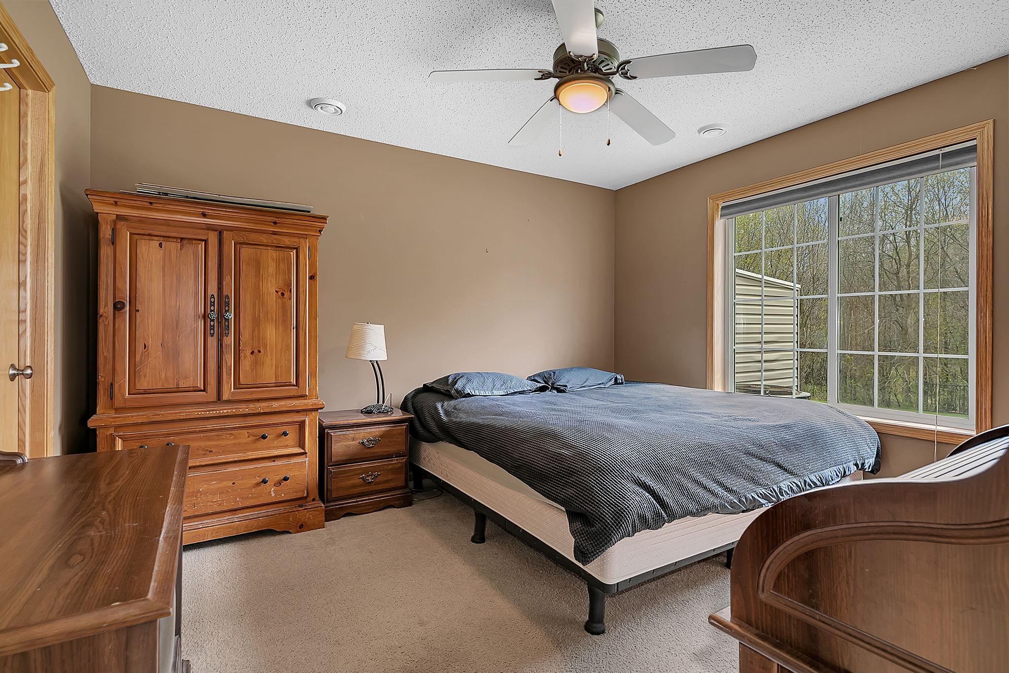 Main floor bedroom with walk in closet