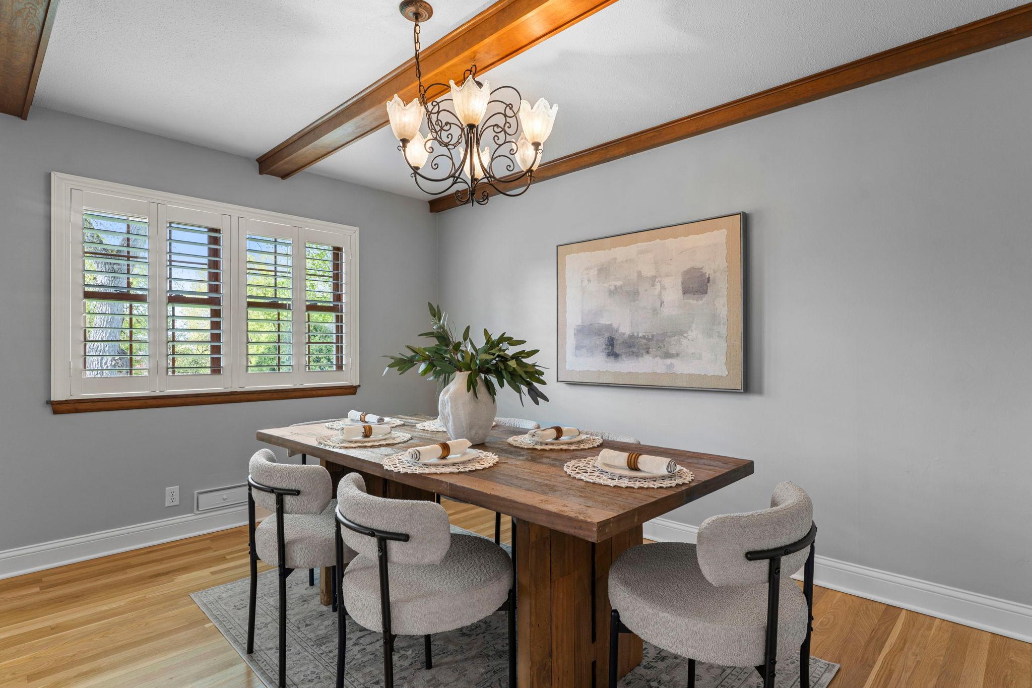 Additional formal dining space is highlighted by elegant lighting and peaceful backyard views that brings in plenty of natural light.