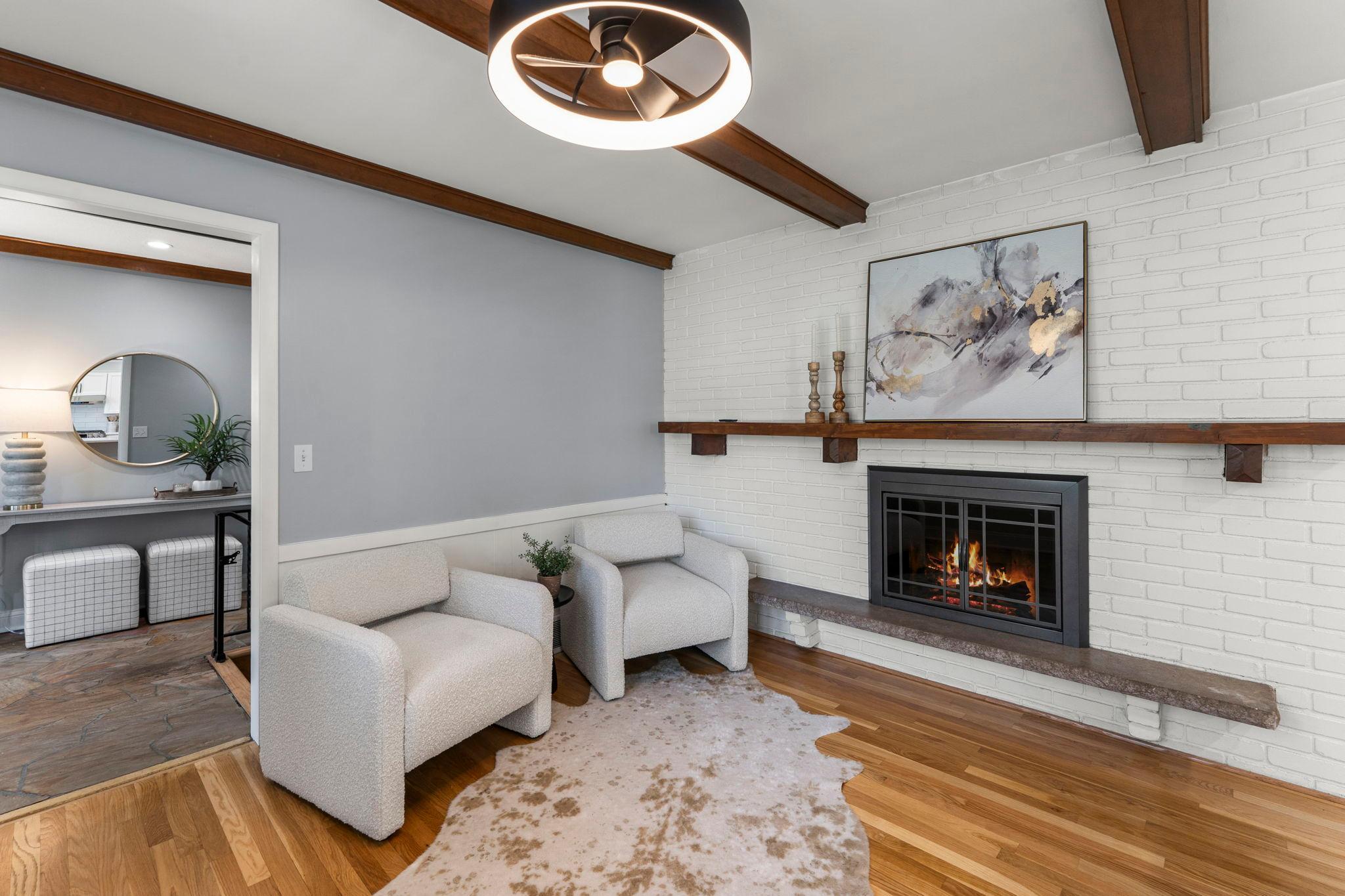 The space is enhanced by a beautiful brick fireplace.