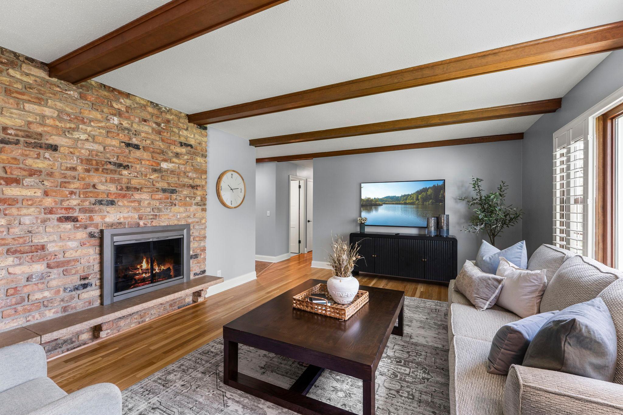 A warm and welcoming space that feels both open and comfortable, enhanced by hardwood floors refinished in 2024 and thoughtfully upgraded doors and hardware throughout.