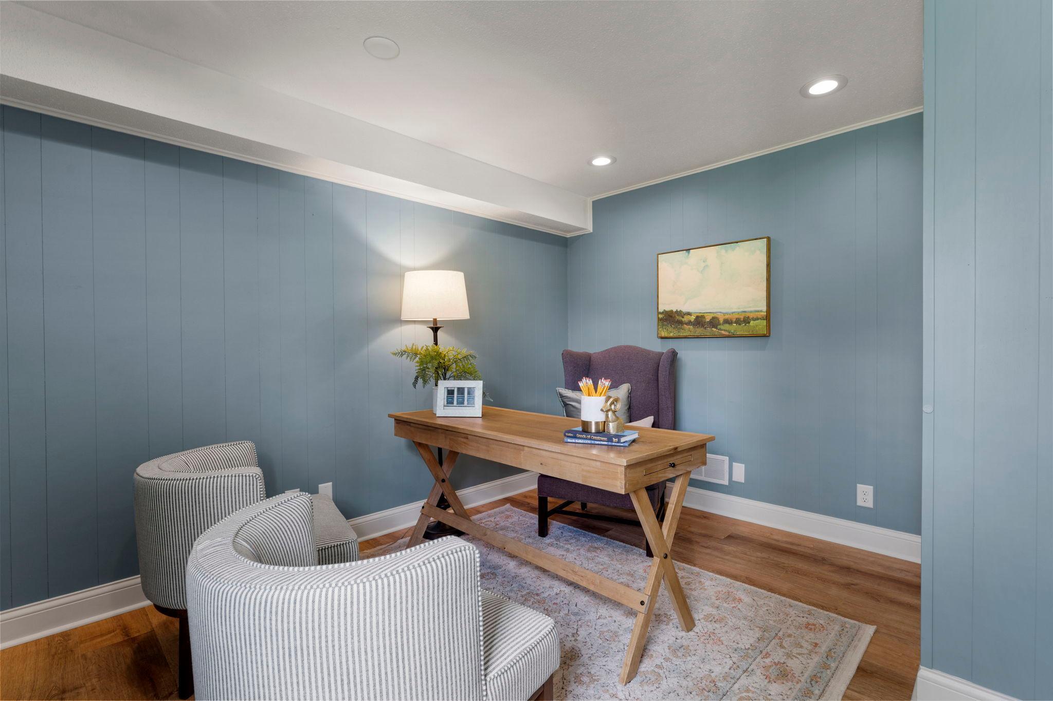 The level is complemented by another room that can serve as a home office, hobby space, or optional fifth bedroom. Both spaces feature abundant natural light and convenient closet space.