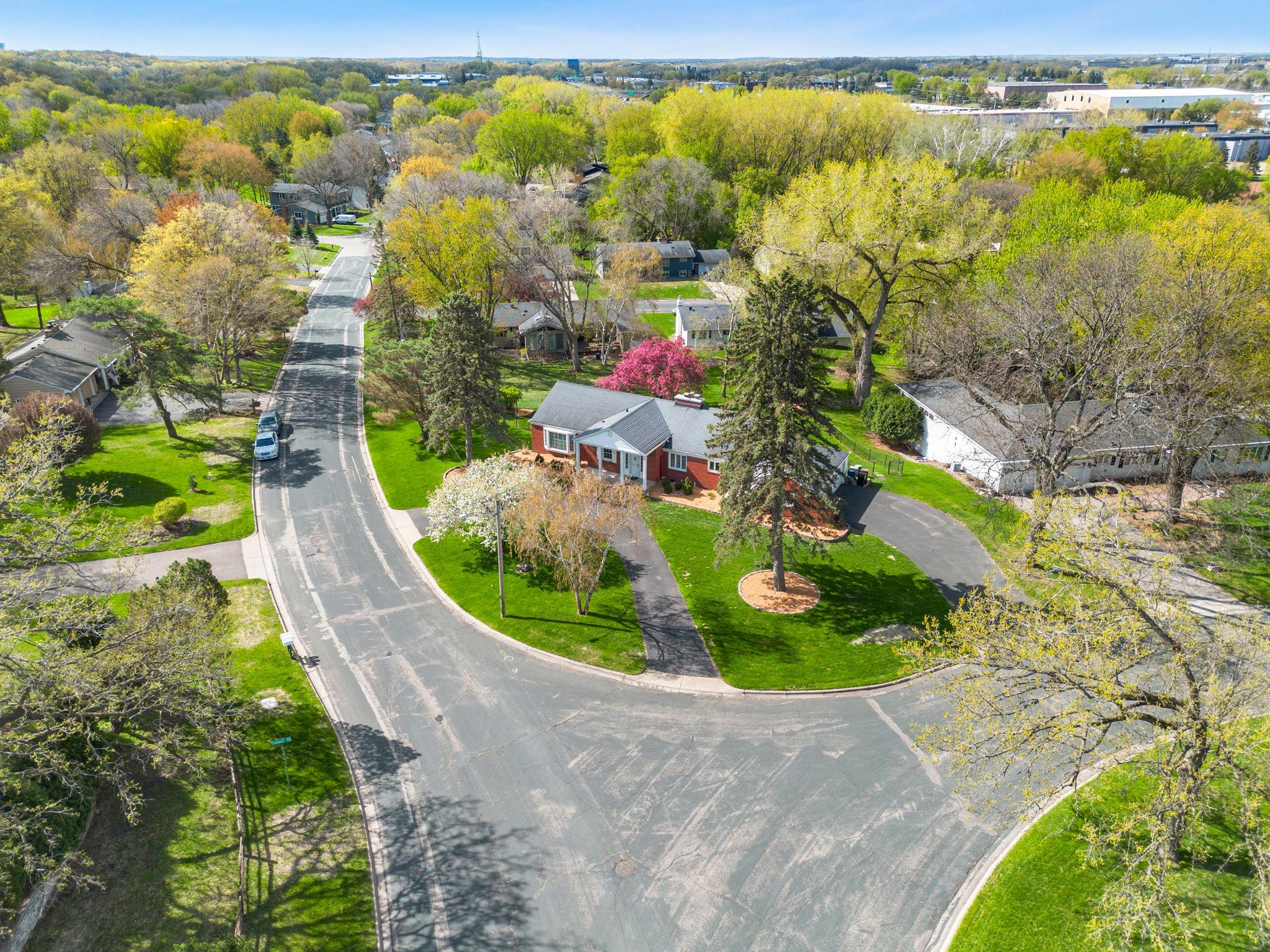 With beautiful landscaping, architectural pillars, inviting front porch, and a classic brick front exterior, this home delivers standout curb appeal from the moment you arrive.