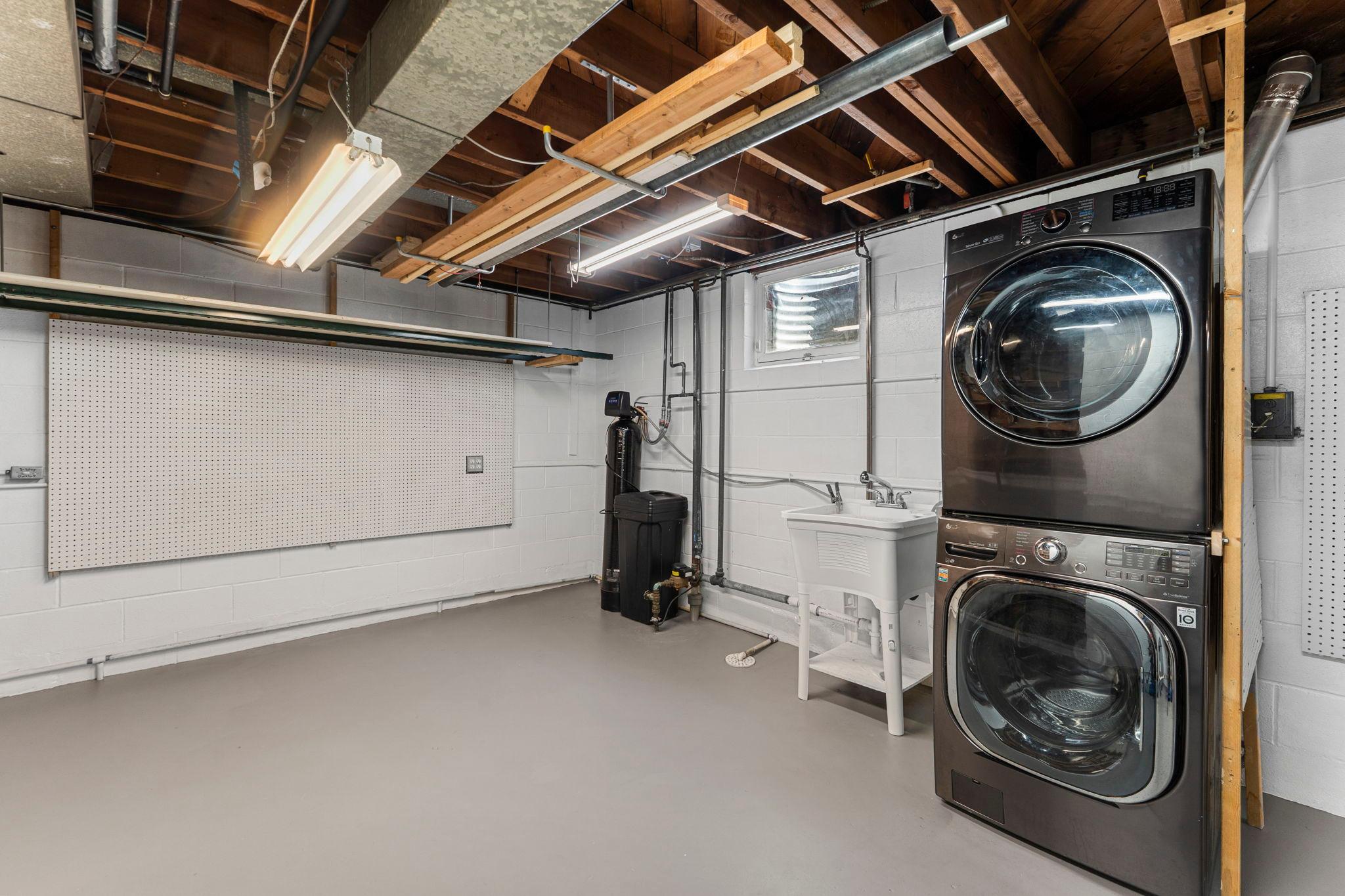 Additional highlights include a cedar closet, and laundry space with LG washer and dryer and a sink for everyday ease. The home also comes with a 3x2x5 steel safe, invisible fence system with two collars and remote, and a full security system.
