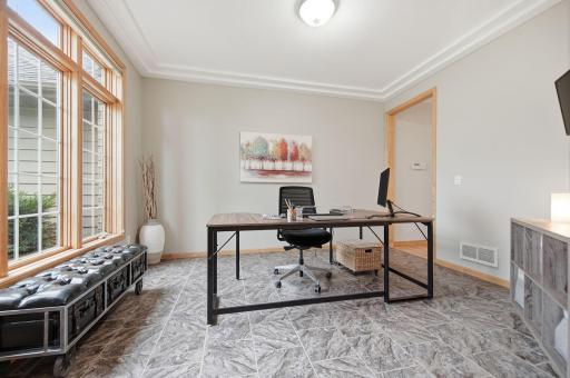 A versatile main floor office offers the flexibility to be converted into a formal dining room.