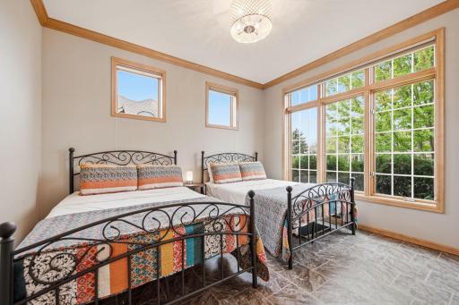 A versatile main floor room can serve as a bedroom, front office, or additional guest space; note that it does not include a closet. Lots of natural sun light.