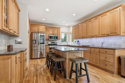 Gourmet kitchen featuring stainless steel appliances, granite countertops, and a new kitchen appliance suite installed in May 2020.