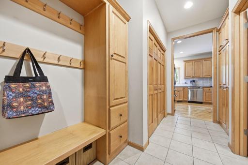 A view from the garage looking into the mudroom/laundry room and kitchen areas.